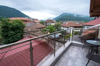 a balcony with a view of a city at Etobicoke -Стаи за гости in Etropole