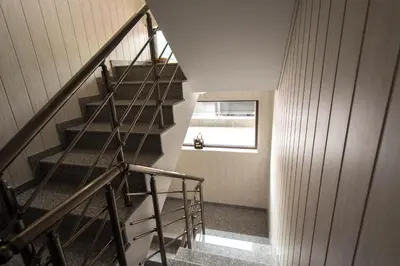 a spiral staircase in a house with a window at Etobicoke -Стаи за гости in Etropole