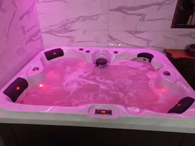 a person in a hot pink bath tub at Възрожденски комплекс Чардакъ Сопот in Sopot