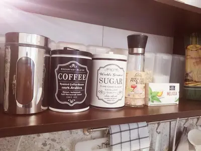 a shelf with three bottles of coffee on it at PIJAMA HOUSE - Bike & Bed in Plovdiv