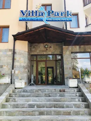 a building with stairs in front of a building at Studio Villa Park Premium in Borovets