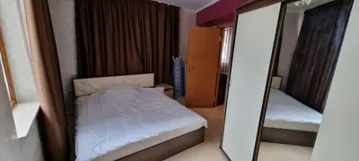 a small bedroom with a bed and a mirror at Snow magic Grand Monastery in Pamporovo