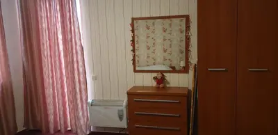 a room with a dresser and a mirror and a window at Snow magic Grand Monastery in Pamporovo
