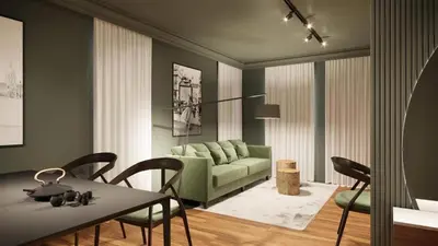 a living room with a green couch and a table at Luxury Green Apartment - up to 4 people in Bansko