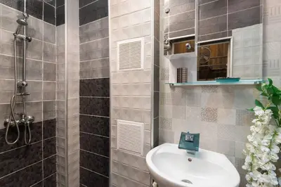 a bathroom with a sink and a shower at VITOSHKA Pleasure place in Sofia