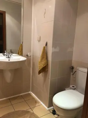 a bathroom with a toilet and a sink at Studio Villa Park Premium Gold in Borovets