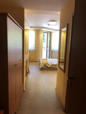 a hallway with a room with a bed and a door at Studio Villa Park Premium Gold in Borovets