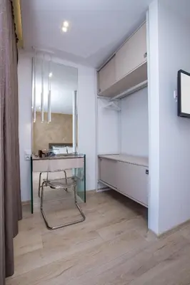 a room with a desk and a chair in a room at South Place Apartments in Sandanski