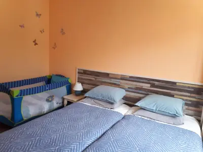 two beds sitting next to each other in a bedroom at Апартамент Allegri Padrini Комплекс Вели Хилс in Velingrad