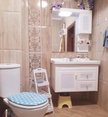 a bathroom with a white toilet and a sink at Апартамент Allegri Padrini Комплекс Вели Хилс in Velingrad