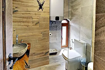 a bathroom with a sink and a toilet at Charming apartment in the heart of Bansko in Bansko