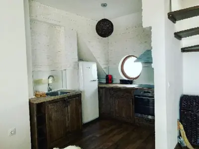 a kitchen with a refrigerator and a sink at Charming apartment in the heart of Bansko in Bansko