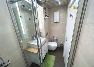 a bathroom with a shower and a sink and a toilet at Unique Luxurious Jacuzzi PENTHOUSE DUPLEX in City Center! 2 BATHS! FREE PARKING! in Sofia