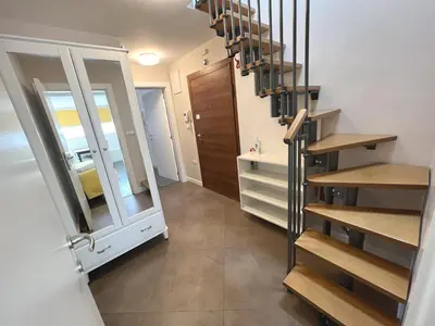 a staircase in a room with a mirror and a bathroom at Unique Luxurious Jacuzzi PENTHOUSE DUPLEX in City Center! 2 BATHS! FREE PARKING! in Sofia