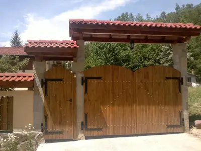 a wooden gate in front of a house at Villa Nanevi in Teteven