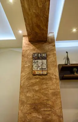a stone wall with a sign on it in a room at Luxury 2 bedroom,2 bathroom apart ,free parking in Plovdiv