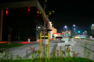 an empty parking lot at night with street lights at Art Apartment 36 in Plovdiv