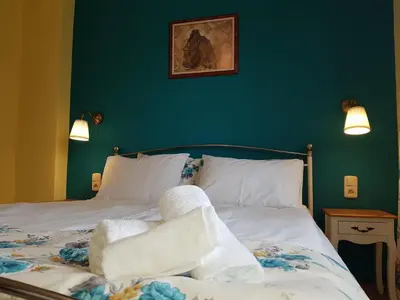 a bedroom with a bed with towels on it at Casa Vivaldi in Velingrad