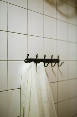 a towel hanging on a towel rack in a bathroom at Beautiful best location apartment Red Mouse in Plovdiv