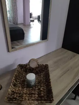 a table with a mirror and a bag on it at Art House Plovdiv in Plovdiv