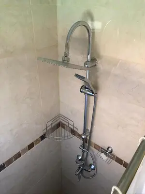 a shower with a faucet in a bathroom at Vila Rila in Sapareva Banya