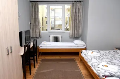 a room with two beds and a window at Santa Sofia in Sofia