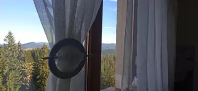 a view of a window with a mirror on it at Пампорово Студио М хотел в Росица in Pamporovo