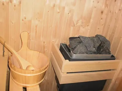 a wooden comb and a box of rocks in a room at Пампорово Студио М хотел в Росица in Pamporovo