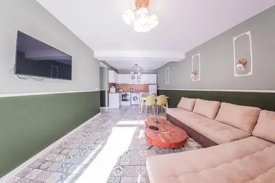 a living room with a couch and a table at Sofia Rococo Life Apartments in Sofia