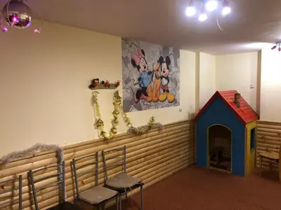 a room with a dog house and a painting on the wall at Apartment 507 The Castle 1 in Pamporovo