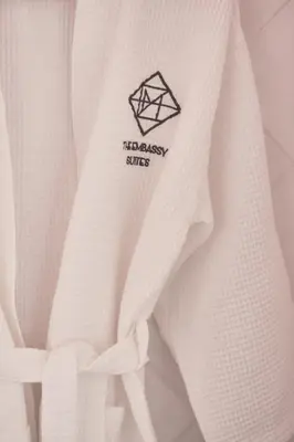 a close up of a white shirt with a black patch at The Embassy Suites in Sofia