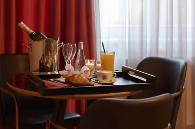 a table with a tray of food and drinks on it at The Embassy Suites in Sofia