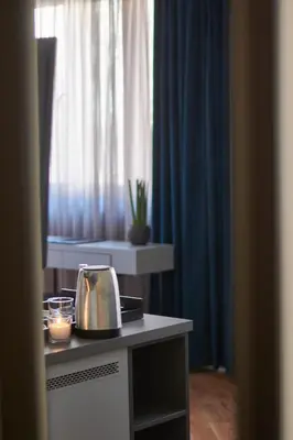 a kitchen with a tea kettle and candles on a counter at The Embassy Suites in Sofia