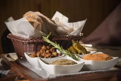 a tray with different types of spices and a basket at Hotel Villa Magus in Kladnitsa
