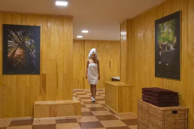 a woman wearing a veil walks through a hallway at Hotel Villa Magus in Kladnitsa