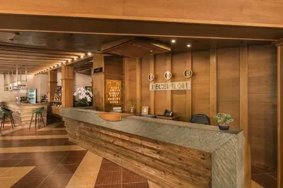 a lobby with a reception counter in a building at Hotel Villa Magus in Kladnitsa