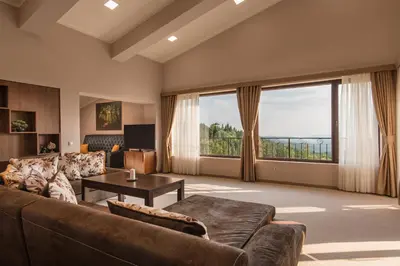 a large living room with a couch and a table at Hotel Villa Magus in Kladnitsa