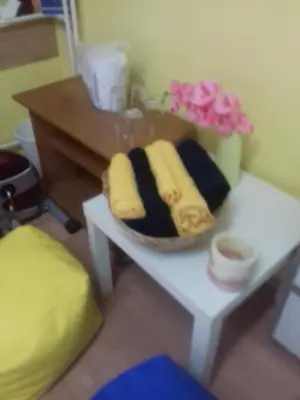 a table with a basket of towels on it at MVK in Sofia