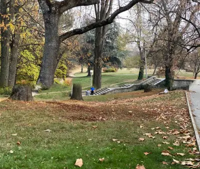 a person sitting on a bench in a park at Fantasy Apartment 15 комплекс Фантазия, Хисаря in Hisarya