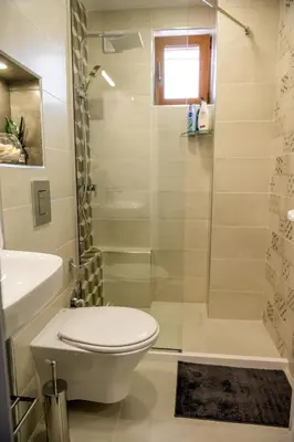 a bathroom with a toilet and a shower at City View Apartment With 2 Bedrooms and Free Garage in Blagoevgrad