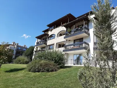 a white building with balconies on the side of it at Studio- apartament Lake View Pravets Golf Resort in Pravets