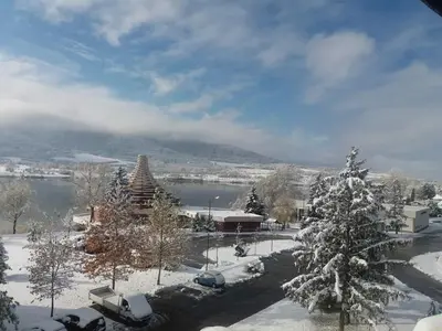 a winter view of a city with snow on the ground at Studio- apartament Lake View Pravets Golf Resort in Pravets