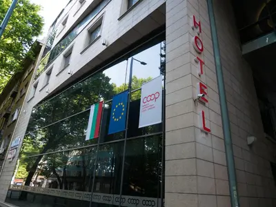 a sign on the side of a building at Hotel Puldin COOP in Plovdiv