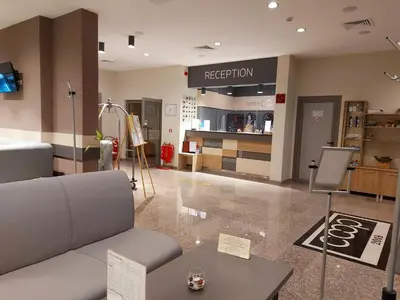 a store with a couch and a table in a room at Hotel Puldin COOP in Plovdiv