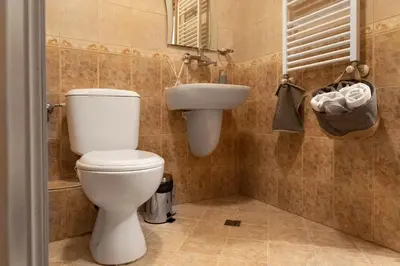 a bathroom with a toilet and a sink at Studio Talisman II in Sofia