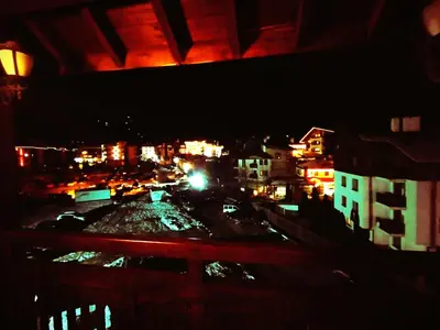 a view of a city at night with traffic at Lucy's Apartments Emerald in Bansko