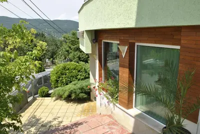 a view of a house with a window at Discret Hotel & Restaurant in Vladaya