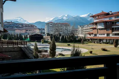 a view from a balcony of a city with mountains at Bansko Royal 721 Apartment in Bansko