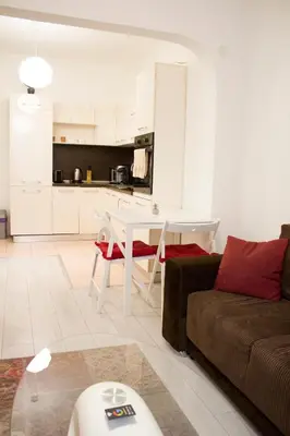 a living room with a couch and a table at Luxury suite near NDK and Viotosha blvd in Sofia