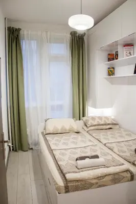 a bedroom with two beds and a window at Luxury suite near NDK and Viotosha blvd in Sofia